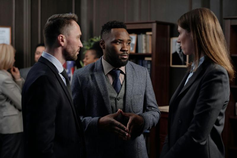 A professional team discussing work in an office